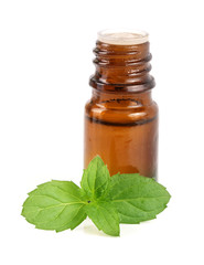 bottle of peppermint oil and fresh mint isolated on white background