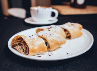 Homemade apple pies decorated with chocolate