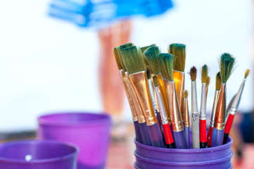 Brushes for drawing in a glass on a background of a picture