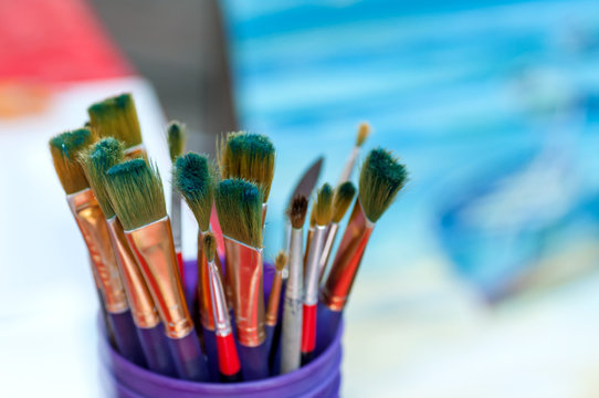 Brushes for drawing in a glass on a background of a picture