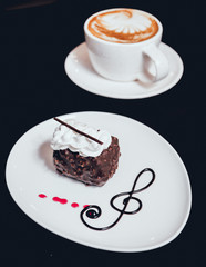 Dessert with cream on the wihte plate