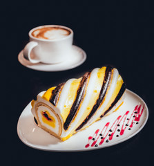 Dessert with cream on the wihte plate