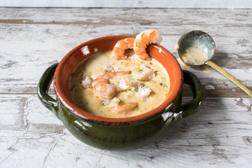 Seafood chowder with ladle in white rustic background - obrazy, fototapety, plakaty