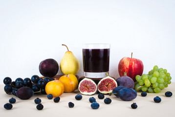 Grape juice with autumn seasonal fruits.