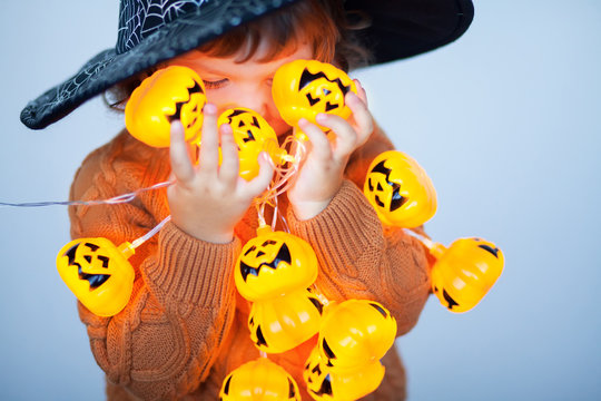 Little kid with halloween decorations