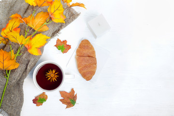 Autumn leaves croissant cup of tea candle