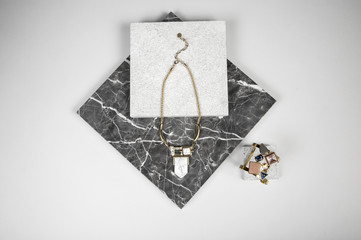 Golden Necklace chain and bracelet on granite