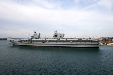 Fototapeta na wymiar Aircraft Carrier in Port