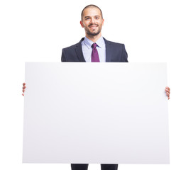 Handsome business man holding a white banner on white background