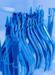 Dental tools on blue background.