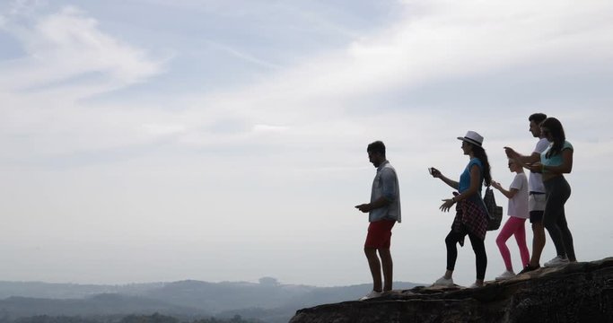 Group Of Tourists On Mountain Top, People Enjoy Landscape With Sunrise Taking Photos On Cell Smart Phone Slow Motion 60