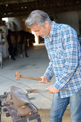 blacksmith working outdoors