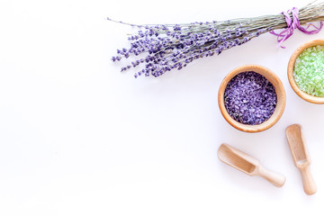 cosmetic set with lavender herbs and sea salt in bowl on white table background flat lay mockup