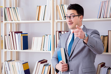 Businessman student reading a book studying in library