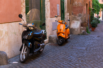 Fototapeta na wymiar old town italian street with bykes in Trastevere, Rome, Italy