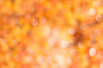 Abstract background in orange-yellow tones.