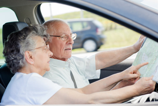 Elderly Couple In The Car