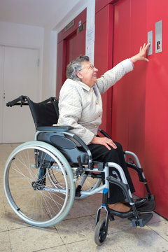 old woman in a wheelchair using lift