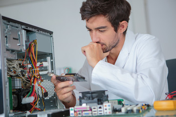 computer engineer working on broken console