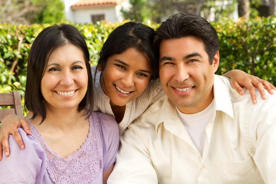 Hispanic Family With A Teen Daughter.