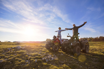 Couple driving off-road with quad bike or ATV © FS-Stock