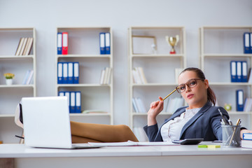 Businesswoman working in the office at desk