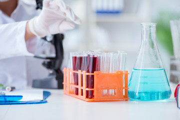 Female scientist researcher conducting an experiment in a labora