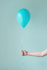 hand holding single green balloon © gillianvann