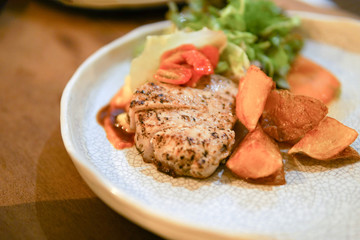 Pork steak in white disc