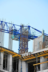 Fototapeta premium Crane and highrise construction site
