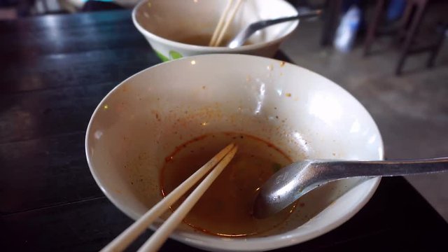 Eating noodle at restaurant in Thailand
