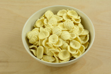 Boiled cooked orecchiette baby ears pasta in white bowl