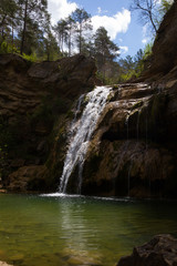 Fototapeta na wymiar Waterfall in Catalonia surrounded by beautiful forests