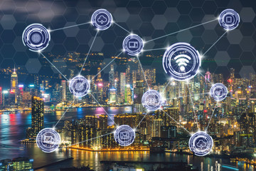 Wireless communication connecting of smart city Internet of Things Technology over the Scene of Hong Kong Cityscape river side at Victoria harbour, technology IOT concept