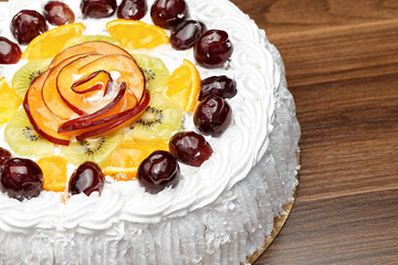 White cake with cream and fruits