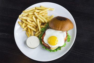 The Meat Burger with egg, sauce and fries. The view from top