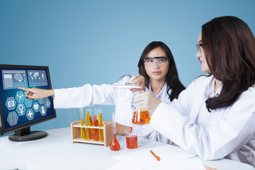 Young scientists doing experiment