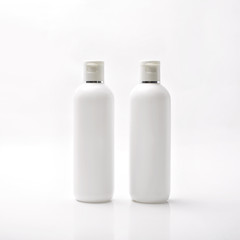 White lotion bottle on white background.