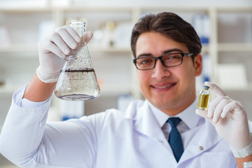 Young researcher scientist doing a water test contamination expe