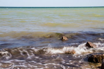 Sea waves splashing over rocks