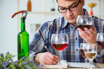 Professional sommelier tasting red wine 