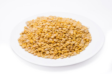 Dry yellow split peas isolated on white background (Soybean halves)