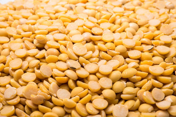 Dry yellow split peas isolated on white background (Soybean halves)