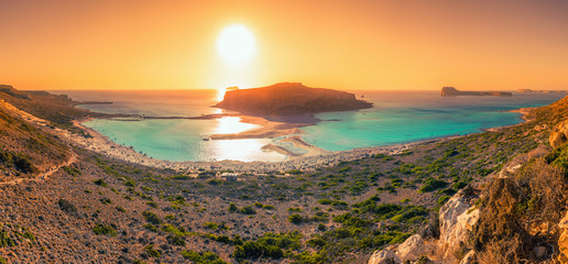 Amazing view of Balos Lagoon  at sunset with magical turquoise waters, lagoons, tropical beaches of pure white sand and Gramvousa island on Crete, Greece © gatsi