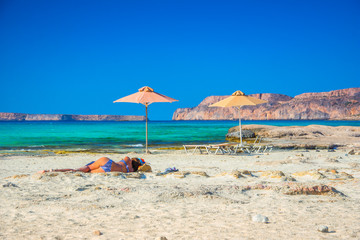 Amazing view of Balos Lagoon with magical turquoise waters, lagoons, tropical beaches of pure white sand and Gramvousa island on Crete, Greece