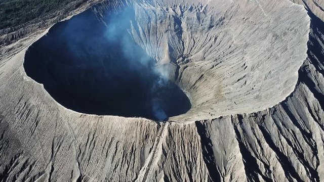 Mountain Bromo active volcano crater in East Jawa, Indonesia. Top view from drone fly. 4K footage
