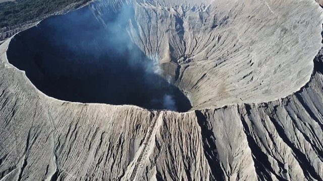 Mountain Bromo active volcano crater in East Jawa, Indonesia. Top view from drone fly. 4K footage