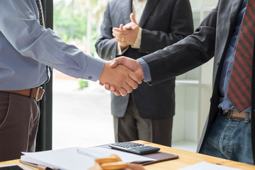 shake hands and clap with three man