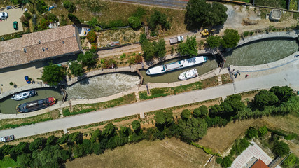 Aerial top view of Fonserannes locks on canal du Midi from above, unesco heritage landmark in France  