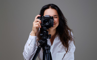 Female taking pictures with a professional photo camera.